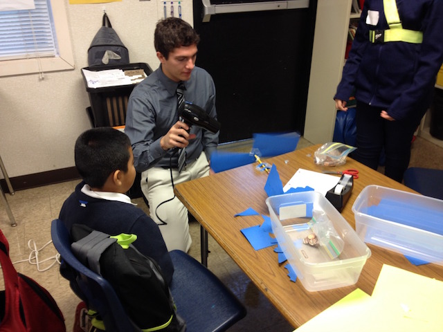 Photo: Connor Speer, senior, cell biology and molecular genetics major, teaching the lesson, "Engineering Challenge: Wind Turbines." 